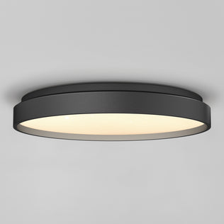 The Artika Celestia 15 in. modern LED flush mount light with remote is installed on a smooth gray ceiling, offering a stylish black finish and soft glowing illumination.