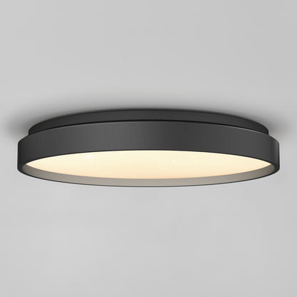 The Artika Celestia 15 in. modern LED flush mount light with remote is installed on a smooth gray ceiling, offering a stylish black finish and soft glowing illumination.