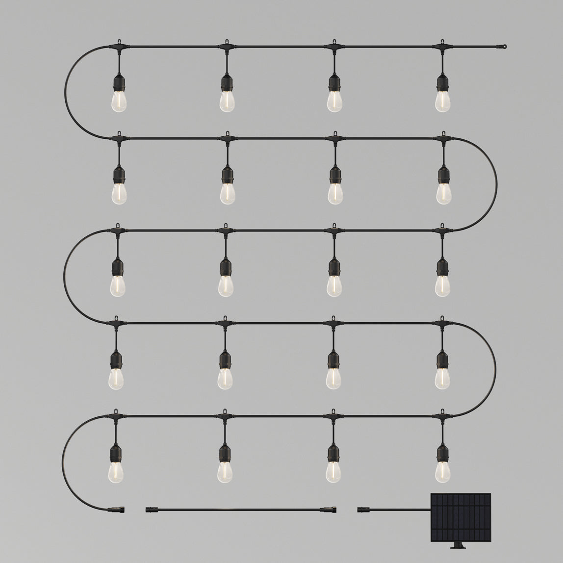 A string of hanging lightbulbs arranged in a zigzag pattern, connected by a black wire, with a small attached solar panel at the bottom right, set against a plain gray background.
