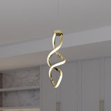 A modern gold spiral pendant light hangs from the ceiling in a minimalist room with light gray cabinets and marble backsplash.