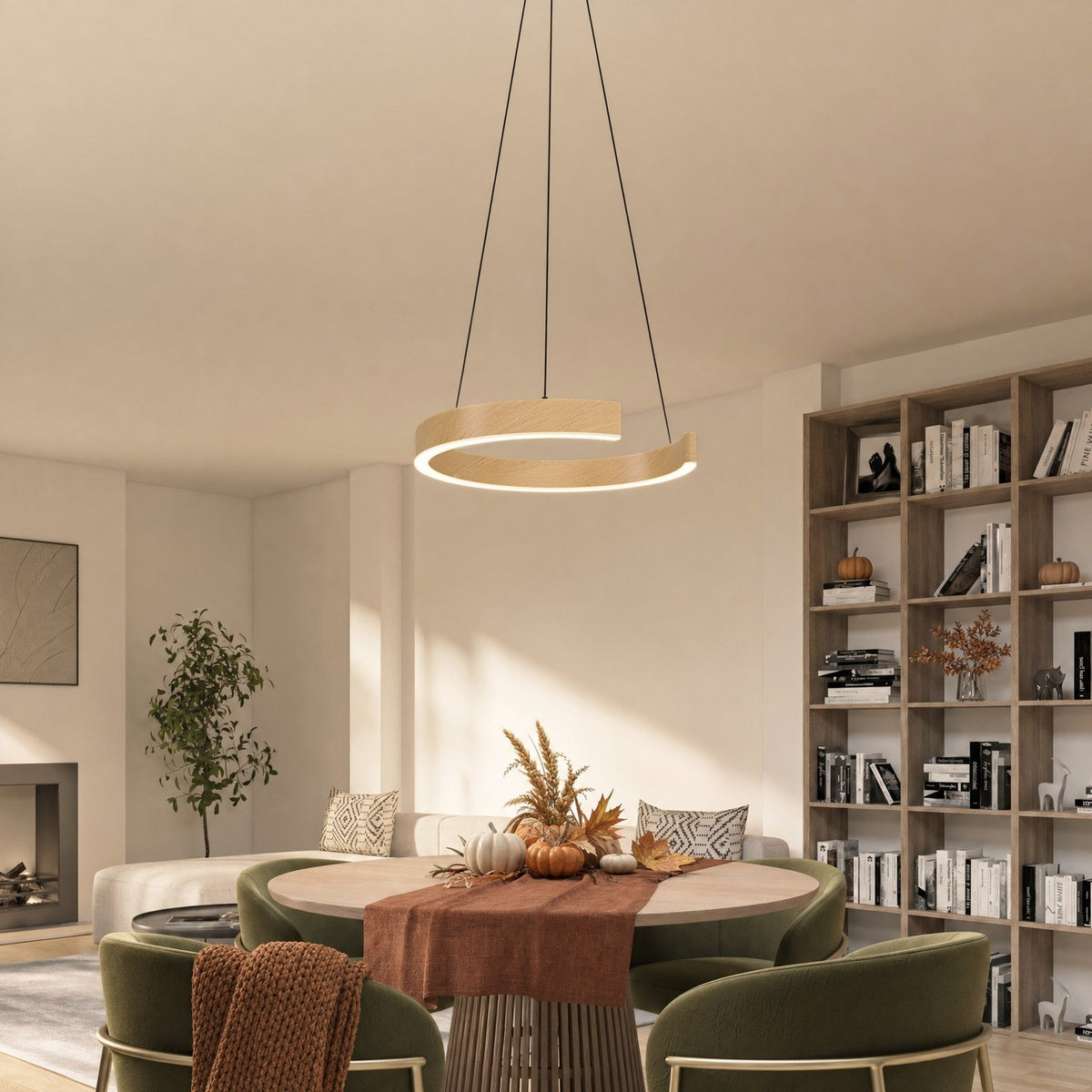 Artika Vance black and wood LED ring pendant over a round dining table set for fall in a sunlit room