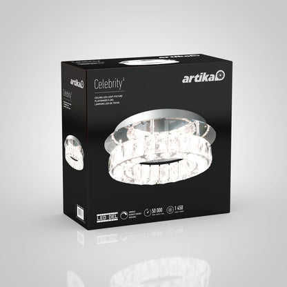A black box branded Artika displays the Celebrity LED flush mount light with a photo of the circular crystal fixture, plus product specs and icons on the front and sides.