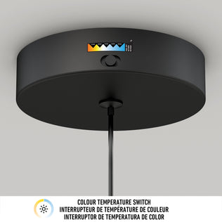 Close-up of the black Hanson 1-light LED pendant by Artika, ceiling-mounted and featuring a 5 CCT color temperature switch with a visible gradient from warm to cool. Text below: COLOUR TEMPERATURE SWITCH in English and French.