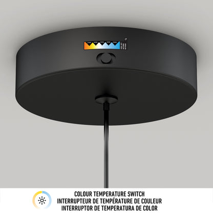Close-up of the black Hanson 1-light LED pendant by Artika, ceiling-mounted and featuring a 5 CCT color temperature switch with a visible gradient from warm to cool. Text below: COLOUR TEMPERATURE SWITCH in English and French.