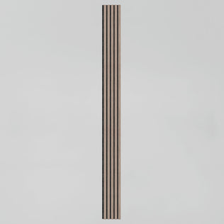 The Artika Sonolok sound-absorbing wall panel kit features a tall, narrow rectangular wooden panel with evenly spaced vertical black grooves, displayed against a plain light grey background.
