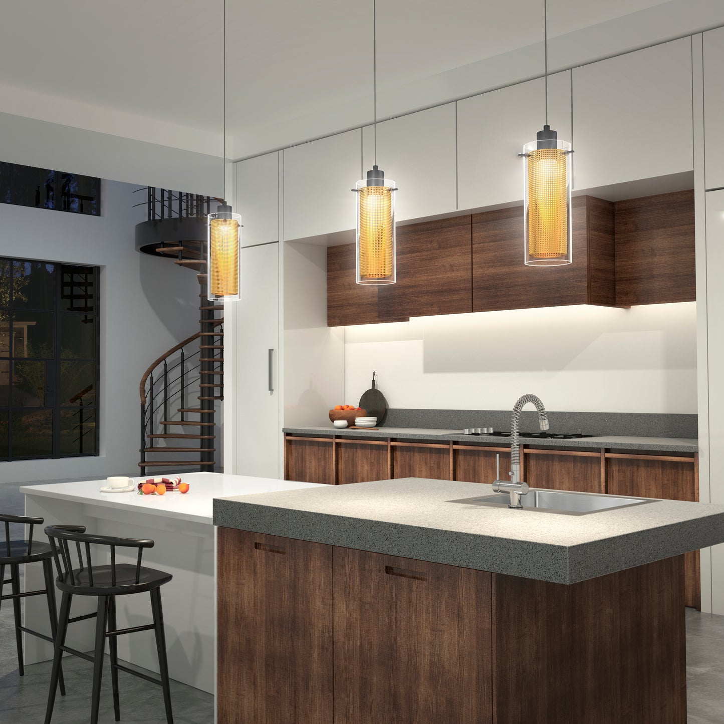 Modern kitchen with wood cabinets, a gray countertop island featuring a built-in sink, bar stools, and a spiral staircase. Artika Oxion 1-light LED pendants hang above, while fruit bowls and decor accents add style to the counters.