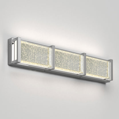 The Artika Subway Essence 3 LED bathroom vanity light features three rectangular, bubble-glass panels in a sleek metal frame, creating a sparkling modern effect on any wall.