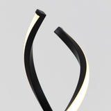 A modern lamp with two black curved arms, each featuring a strip of white LED light, set against a plain light gray background.