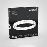 Box packaging for the Artika Celebrity LED pendant light showcases a glowing circular crystal chandelier on a black background, with product features and specifications listed at the bottom.