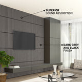 Modern living room with a wall-mounted TV on a dark grey and black slatted panel wall, floating shelves, tall cabinets, and large windows with sheer curtains. Text highlights superior sound absorption and the finish colors.