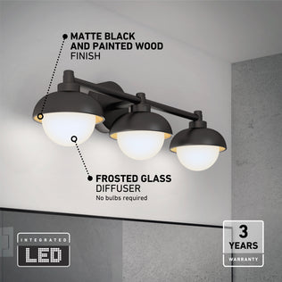 The Artika Boden 27-in Integrated LED 5-CCT Vanity Light Bar for Bathroom features a matte black and painted wood finish, three frosted glass diffusers, adjustable color temperature, integrated LEDs, no bulbs required, and a 3-year warranty.