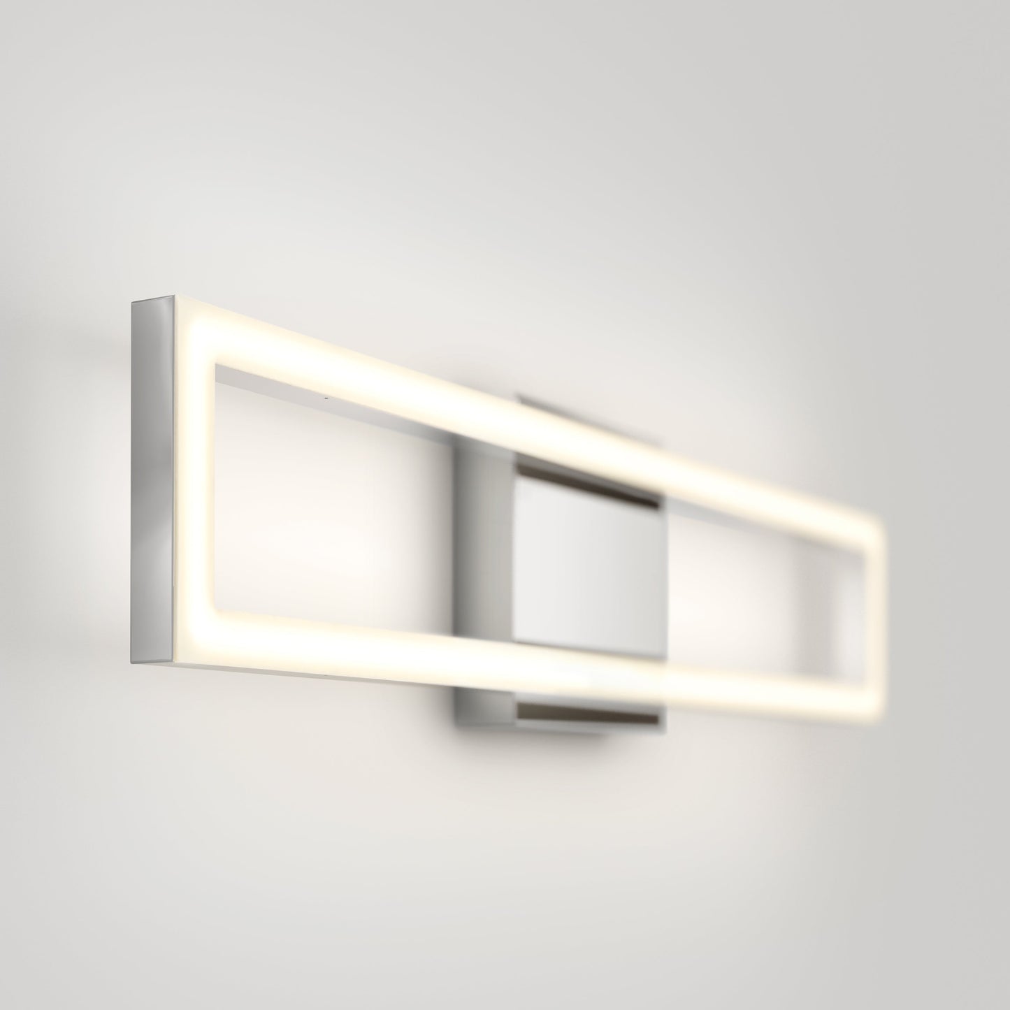 The Artika-CAN-dev Dover modern LED bathroom vanity light 5 CCT features a sleek metal frame and emits a soft, even glow, perfectly mounted on a plain white wall.