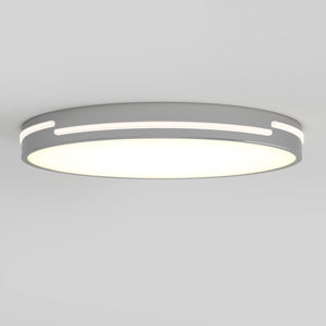 The Artika Delray 15.7 in. LED modern flush mount features a matte black finish, white illuminated center, narrow edge accents, and adjustable 5 CCT colour balance, shown mounted on a plain light-colored ceiling.