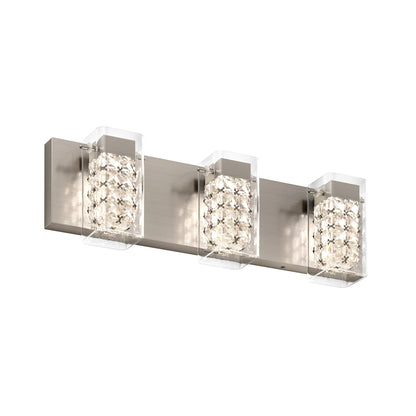The Artika Crystal Cube LED bathroom vanity light features a brushed metal base and three cube-shaped crystal glass shades with geometric facets, delivering bright, stylish illumination for any modern space.
