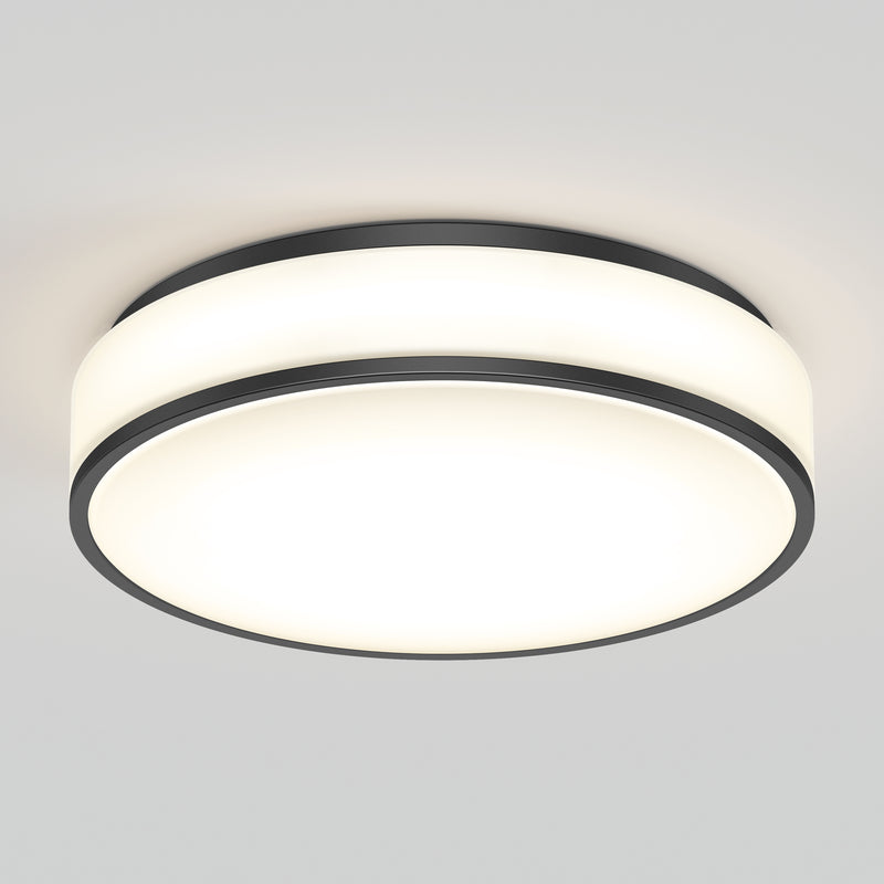 The Artika Giada 15 in. LED modern flush mount light features a sleek round design with a white frosted diffuser and black trim, offering bright, even illumination for any plain white ceiling. Select from 5 CCT options to suit your space.