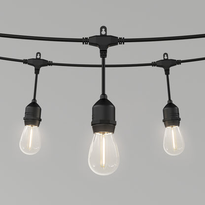 Three vintage-style bulbs hang from the Artika Blaze 20 LED Outdoor Solar String Lights, a sleek black, weather-resistant fixture. Each emits a warm, soft glow—perfect for adding charm to any outdoor area.