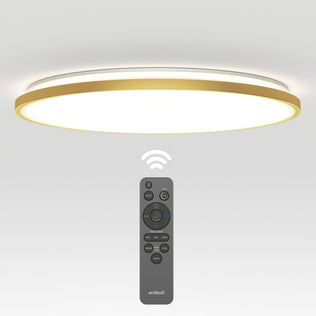 The Artika Europa 21 in. LED modern flush mount light features gold trim and soft white illumination, shown above its black remote control with buttons for brightness and color temperature adjustments.