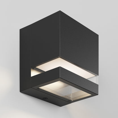 The Artika Valor Square LED wall light casts a soft glow from top and bottom on a white wall.