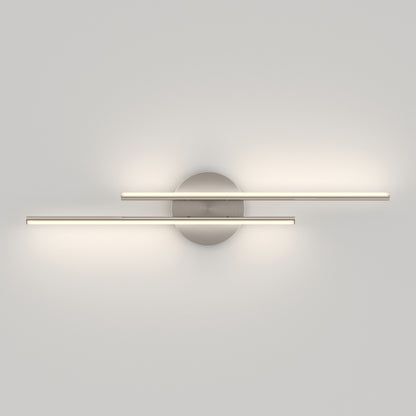 The Artika Cisco modern LED bathroom vanity light 5 CCT features two parallel horizontal LED bars on a round metallic base, casting soft light on a white wall for a minimalist look.