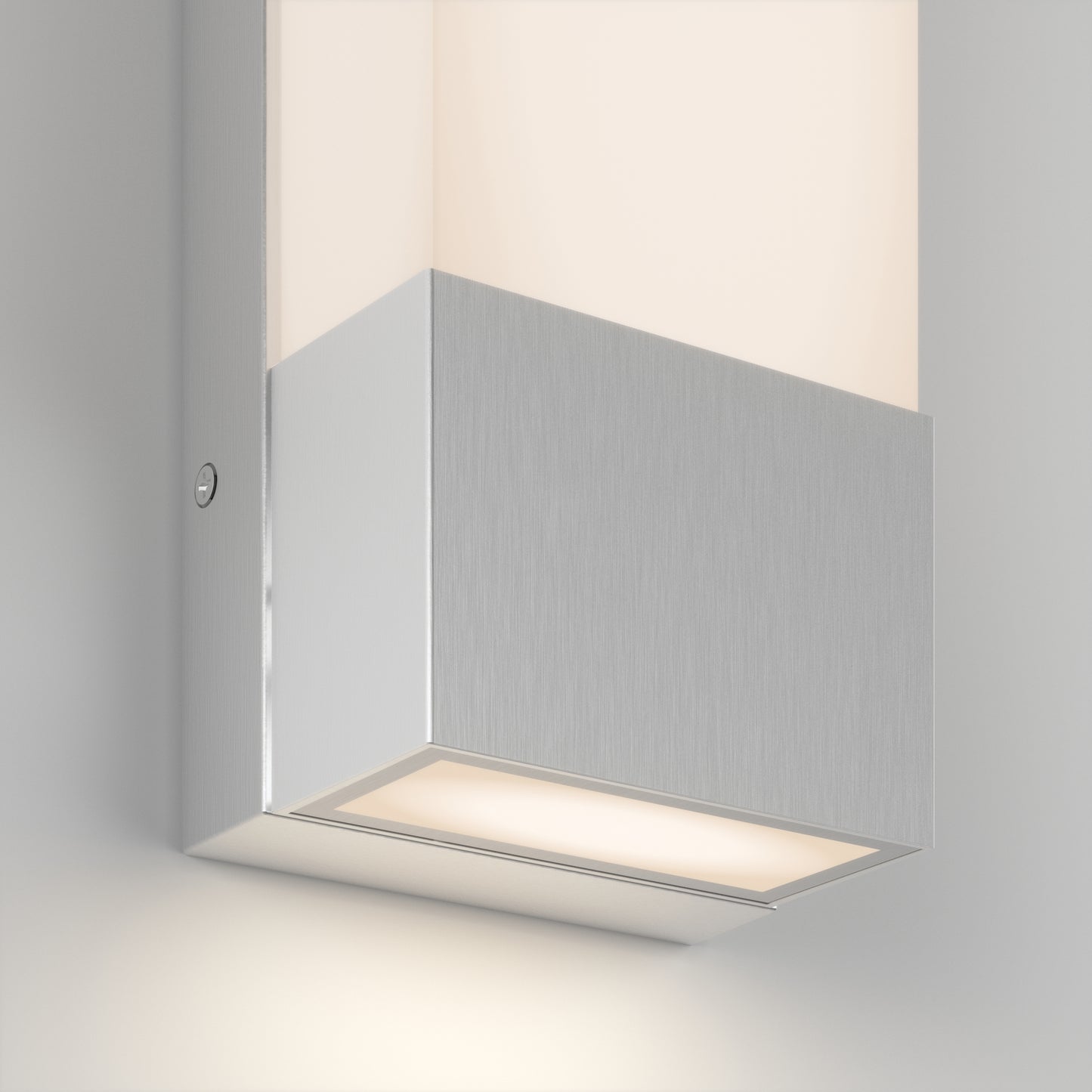 The Artika Dixon indoor-outdoor LED wall light features a brushed metal finish and rectangular design, casting soft illumination from both the top and bottom.