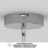A close-up of a ceiling-mounted light fixture with a colour temperature switch indicator on the metal base, showing adjustable white light options. Text below reads COLOUR TEMPERATURE SWITCH in English and French.