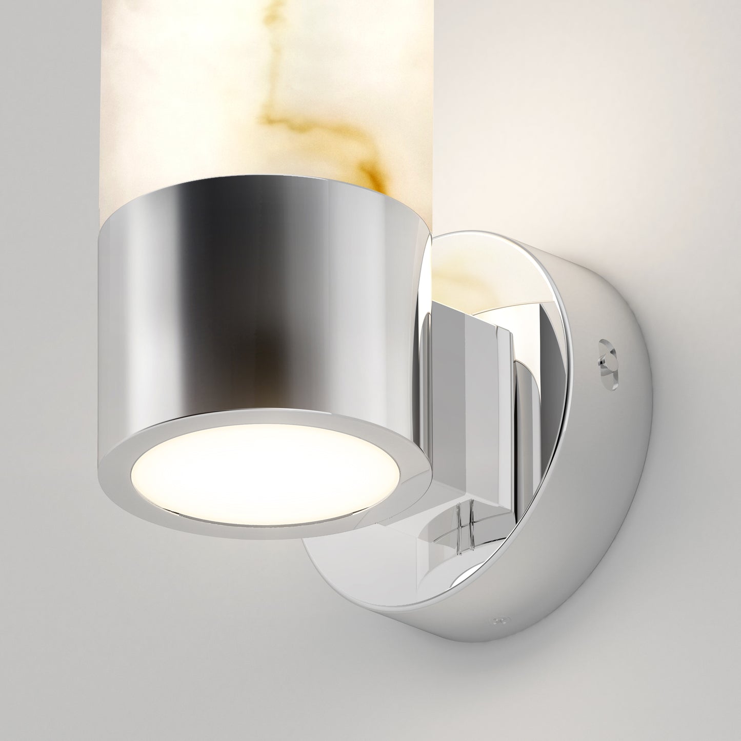 The Artika Marble LED contemporary sconce 5 CCT features a cylindrical light fixture with a polished chrome base and a frosted glass shade with amber veining, all mounted on a smooth round wall plate.