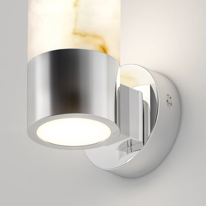 The Artika Marble LED contemporary sconce 5 CCT features a cylindrical light fixture with a polished chrome base and a frosted glass shade with amber veining, all mounted on a smooth round wall plate.