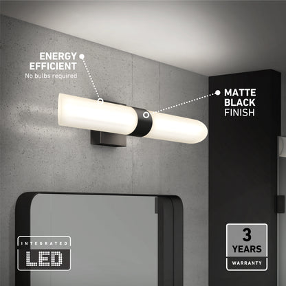 The Artika Wilton LED modern bathroom vanity light 5 CCT, in a matte black finish, is mounted above a mirror on a gray wall. Highlights include energy efficiency, integrated LEDs, and a 3-year warranty.