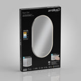 A black box for an Artika Royce Oval LED mirror features an image of the mirror with a glowing edge. The packaging displays product details, energy ratings, features, and a hand operating touch controls.