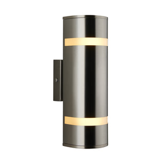 The Artika Q1 indoor-outdoor wall light features a modern cylindrical design in brushed metal with two horizontal frosted bands, emitting soft light from a rectangular wall plate.