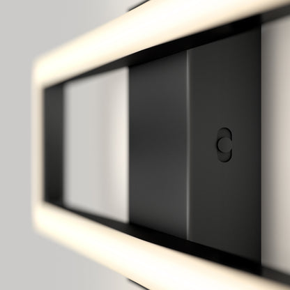 A close-up of the Artika Dover modern LED bathroom vanity light 5 CCT, featuring a sleek black rectangular frame and soft, diffused edge lighting, set against a neutral background.