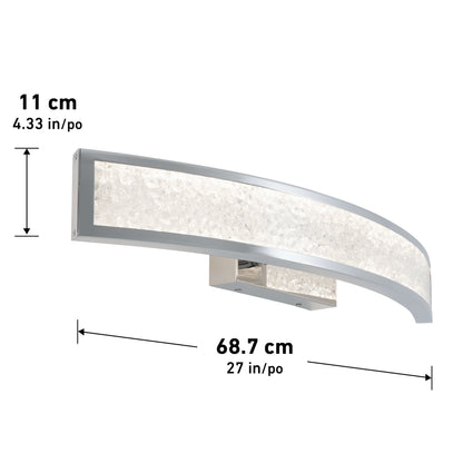 The Artika Glitter LED bathroom vanity light features a modern curved design with a frosted texture, silver edges, and a rectangular base. It measures 11 cm (4.33 in) high by 68.7 cm (27 in) wide.