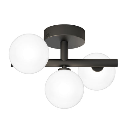 The Artika Bloom LED flush mount is a modern ceiling light featuring a dark metal base and three white glass globe shades arranged in a triangle.