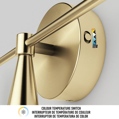 Close-up of the Artika Wayden LED mid-century bathroom vanity light 3 CCT, a gold wall-mounted fixture with color temperature switch. Label and text below say: “Colour temperature switch” in English, French, and Spanish.