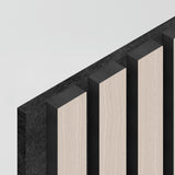 A minimalist image showing vertical rectangular panels with alternating light wood and dark black surfaces, arranged in parallel against a light grey background.