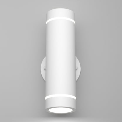 The Artika C7 indoor-outdoor LED wall light 3 CCT is a modern cylindrical white sconce with subtle circular bands, mounted on a round base against a plain light gray wall.