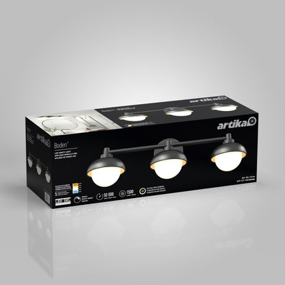 A rectangular box displays the Artika Boden LED mid-century bathroom vanity light 5 CCT, a black three-light fixture with round white shades. Product features and specs appear on a gray background.