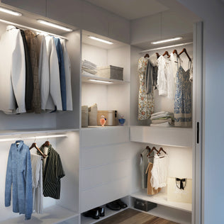 Modern walk-in closet with clothes, shelves, handbags, and soft Impulse Under-Cabinet LED Light RGB+CCT by Artika.