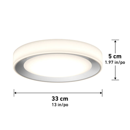 Artika’s Cooper LED flush mount light with remote is a round white ceiling fixture, 33 cm (13 in) wide and 5 cm (1.97 in) high. Dimensions are shown with arrows next to and below the product.