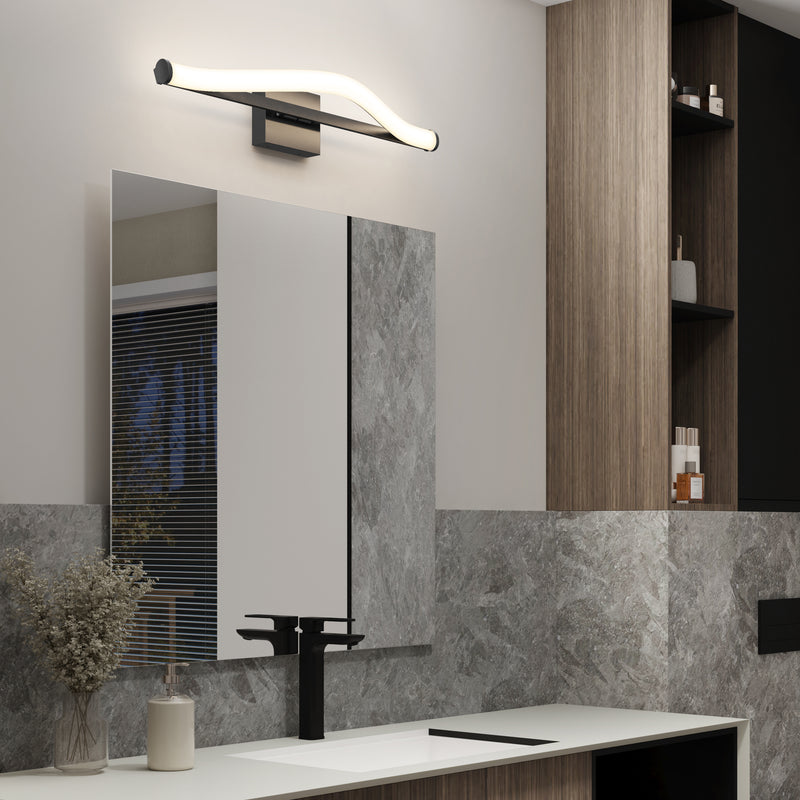 Modern bathroom with large mirror, Artika Arc 27-in LED vanity light bar above, black faucet, marble walls, and wooden shelves.