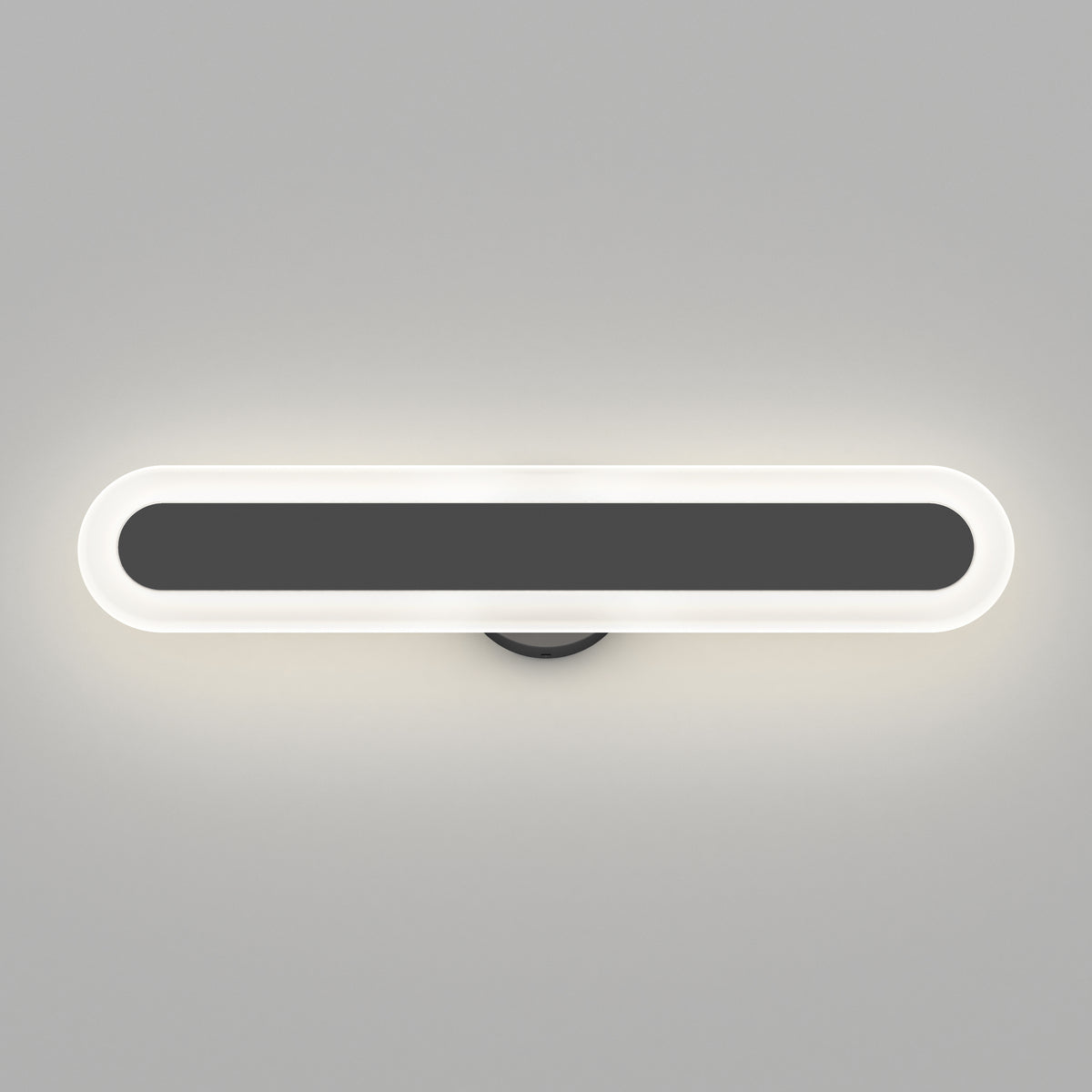 A modern, oval-shaped wall light with a black center and a glowing white border, mounted on a light gray wall. The fixture emits a soft, even illumination around its edges.