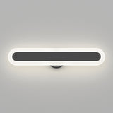 A modern, oval-shaped wall light with a black center and a glowing white border, mounted on a light gray wall. The fixture emits a soft, even illumination around its edges.