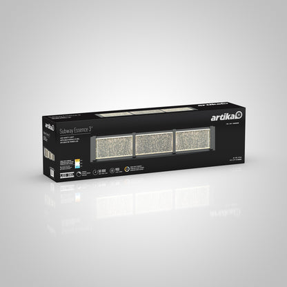 A rectangular black box labeled Artika Subway Essence 3 LED bathroom vanity light shows images of three rectangular LED lights on the front, with product details and specifications in white text.