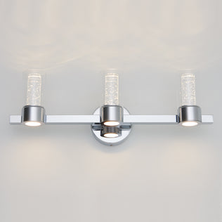 The Artika Novello modern LED bathroom vanity light features three cylindrical glass shades and a sleek chrome finish.