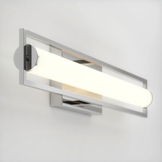 The Rialto modern LED bathroom vanity light 3 CCT by Artika features dimmable lighting with a horizontal frosted glass shade, framed by a sleek rectangular metal structure, and mounts elegantly on a white wall.