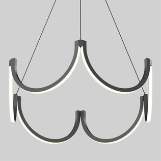 The Artika Adelia LED pendant light 5 CCT is a modern chandelier with two tiers of curved black metal arms and integrated LED lights, suspended by three thin cables against a plain light gray background.