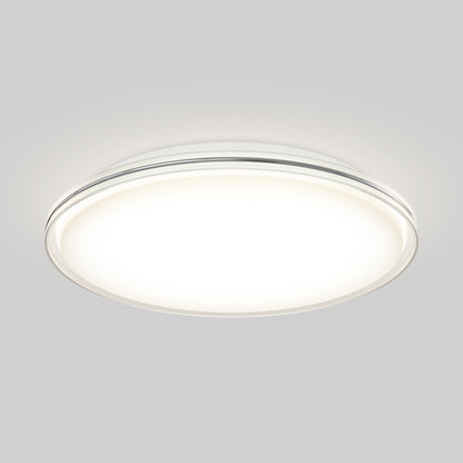 The Artika Astrid 16.5 in. LED flush mount light 5 CCT with remote, a round white ceiling fixture, is illuminated against a plain, light gray background.