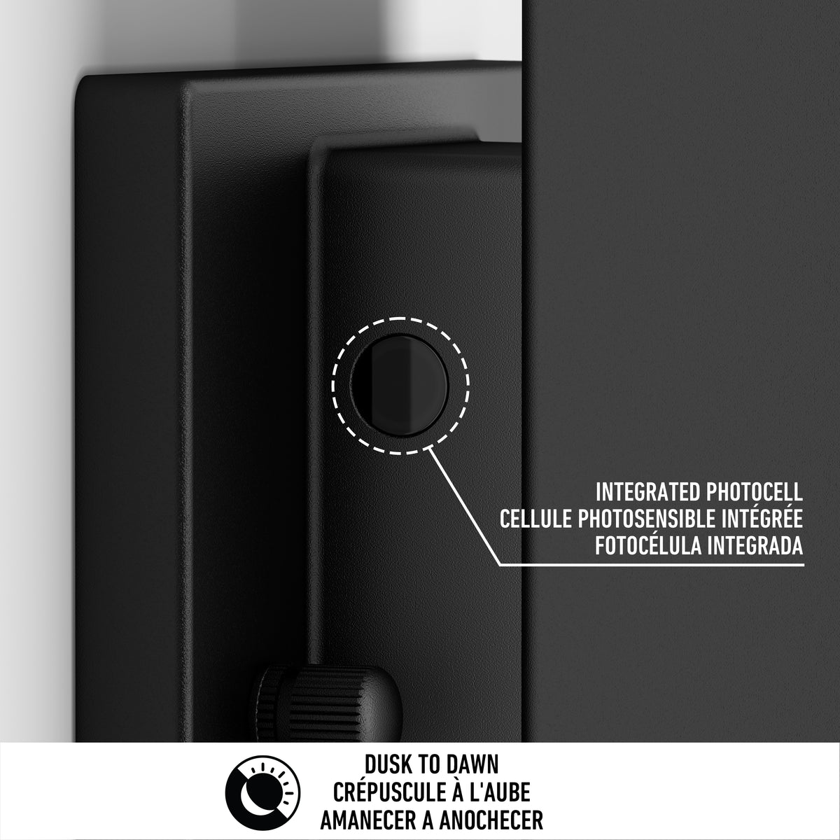Close-up of a black outdoor light fixture showing an integrated photocell sensor. Text in English, French, and Spanish points to the sensor. A dusk to dawn icon and text are at the bottom.