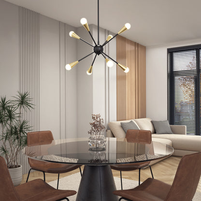 A modern dining area features a round glass table, four brown chairs, an Artika Wayden modern LED pendant light 3 CCT, a beige sectional sofa, a potted plant, and large windows with black blinds letting in natural light.