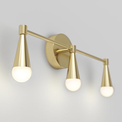 The Artika Wayden LED mid-century bathroom vanity light features three gold cone-shaped arms with round frosted bulbs, wall-mounted against a light gray background.